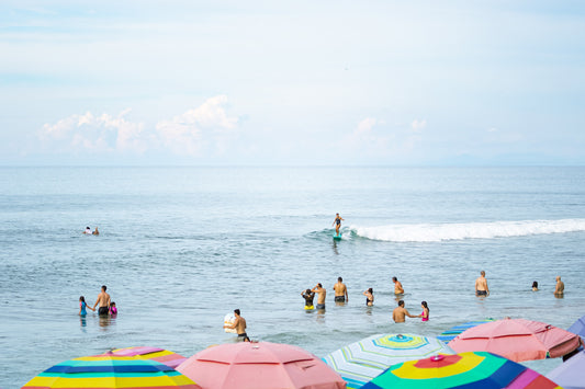 Colourful umbrellas on Sayulita beach, surf inspired ocean fine art photography print.