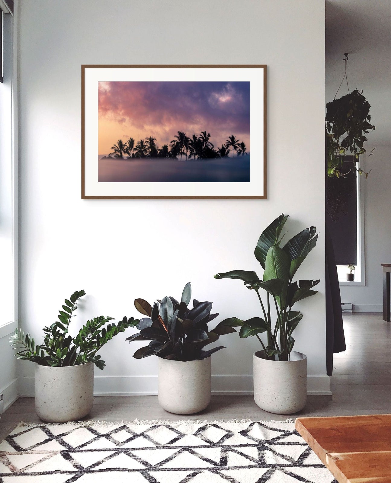 Mexican moody sunrise with silhouetted palm trees with beautiful vivid colours framed by the clouds and the ocean