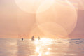 Surfing print showcasing surfers against a dreamy sunset glow over ocean waves in Baja California, Mexico