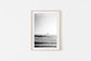 Framed Lone surfer walking toward surf on Central American coast, black and white surf photography print