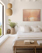 Dreamy surfing print showcasing a serene sunset in a minimalist bedroom setting.