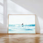 Dreamy ocean photography print — soft blue seas and morning light captured a surfer in Drift, a coastal fine art print.