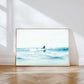 Dreamy ocean photography print — soft blue seas and morning light captured a surfer in Drift, a coastal fine art print.